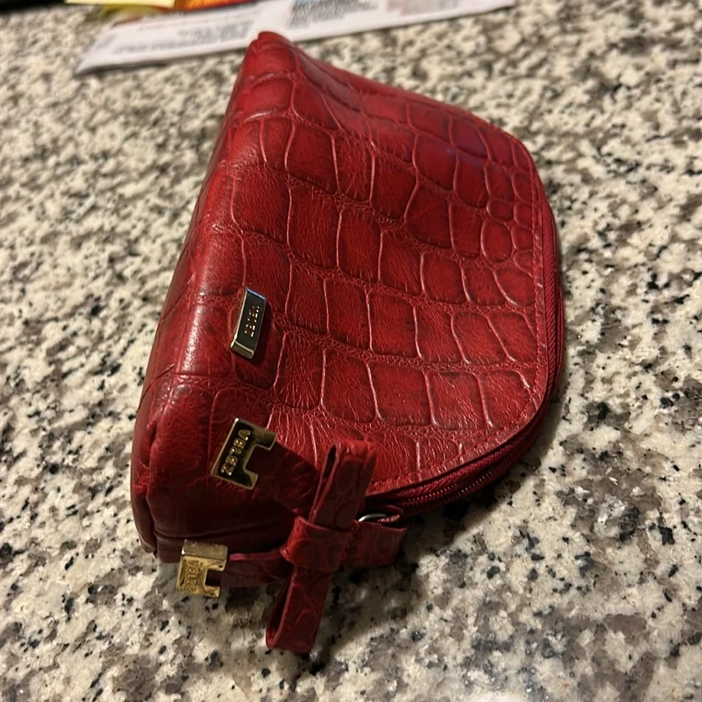 Velez Red Leather(?) Zippered Make-Up Bag w/Silver Lining. 8” W x 4 1/2” H. Good